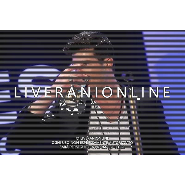 Singer Robin Thicke performs during the grand opening of EXPRESS Times Square on March 25, 2014 in New York City. AG ALDO LIVERANI SAS ONLY ITALY