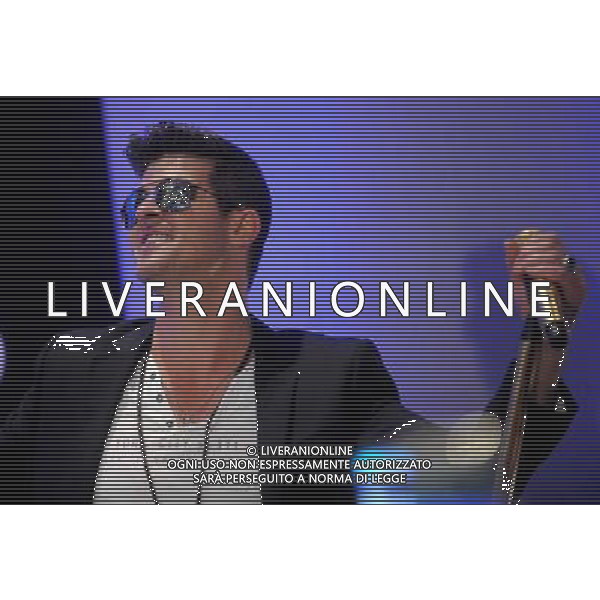 Singer Robin Thicke performs during the grand opening of EXPRESS Times Square on March 25, 2014 in New York City. AG ALDO LIVERANI SAS ONLY ITALY