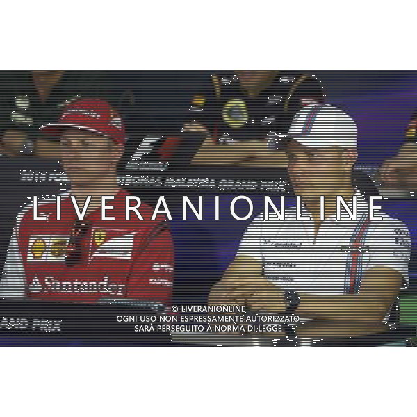 (L to R): Kimi Raikkonen (FIN) Ferrari and Valtteri Bottas (FIN) Williams in the FIA Press Conference. 27.03.2014. Formula 1 World Championship, Rd 2, Malaysian Grand Prix, Sepang, Malaysia, Thursday. - www.xpbimages.com, EMail: requests@xpbimages.com - copy of publication required for printed pictures. Every used picture is fee-liable. © Copyright: Price / XPB Images AG ALDO LIVERANI SAS ONLY ITALY