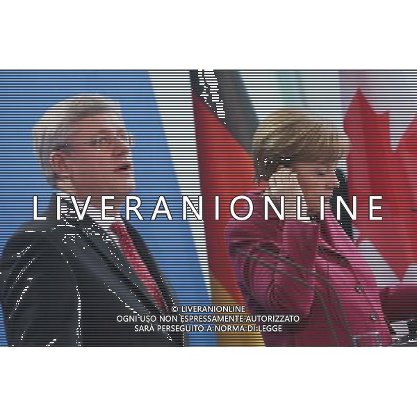 (140327) -- BERLIN, March 27, 2014 () -- German Chancellor Angela Merkel (R) and visiting Canada\'s Prime Minister Stephen Harper attend a press conference in Berlin, Germany, on March 27, 2014. (/Zhang Fan) AG ALDO LIVERANI SAS ONLY ITALY