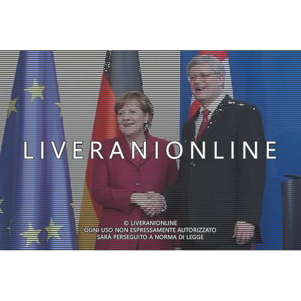 (140327) -- BERLIN, March 27, 2014 () -- German Chancellor Angela Merkel (L) and visiting Canada\'s Prime Minister Stephen Harper attend a press conference in Berlin, Germany, on March 27, 2014. (/Zhang Fan) AG ALDO LIVERANI SAS ONLY ITALY