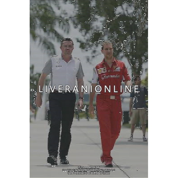 (L to R): Eric Boullier (FRA) McLaren Racing Director with Renato Bisignani (ITA) Ferrari Head of Communications. 30.03.2014. Formula 1 World Championship, Rd 2, Malaysian Grand Prix, Sepang, Malaysia, Sunday. - www.xpbimages.com, EMail: requests@xpbimages.com - copy of publication required for printed pictures. Every used picture is fee-liable. © Copyright: Price / XPB Images AG ALDO LIVERANI SAS ONLY ITALY