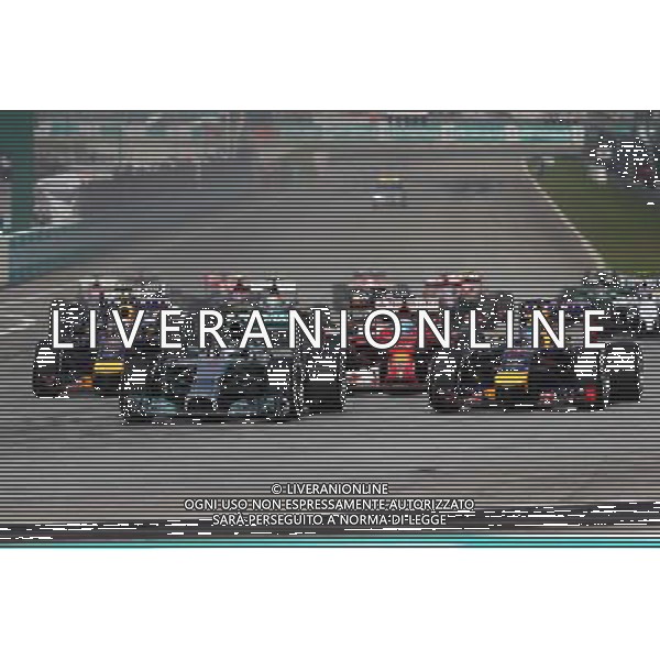 Nico Rosberg (GER) Mercedes AMG F1 W05 and Sebastian Vettel (GER) Red Bull Racing RB10 at the start of the race. 30.03.2014. Formula 1 World Championship, Rd 2, Malaysian Grand Prix, Sepang, Malaysia, Sunday. - www.xpbimages.com, EMail: requests@xpbimages.com - copy of publication required for printed pictures. Every used picture is fee-liable. © Copyright: Charniaux / XPB Images AG ALDO LIVERANI SAS ONLY ITALY