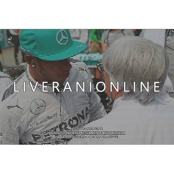 (L to R): Lewis Hamilton (GBR) Mercedes AMG F1 with Bernie Ecclestone (GBR) on the grid. 30.03.2014. Formula 1 World Championship, Rd 2, Malaysian Grand Prix, Sepang, Malaysia, Sunday. - www.xpbimages.com, EMail: requests@xpbimages.com - copy of publication required for printed pictures. Every used picture is fee-liable. © Copyright: Batchelor / XPB Images ag aldo liverani sas only italy