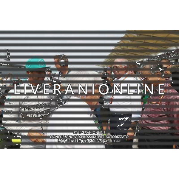 (L to R): Lewis Hamilton (GBR) Mercedes AMG F1 with Bernie Ecclestone (GBR) on the grid. 30.03.2014. Formula 1 World Championship, Rd 2, Malaysian Grand Prix, Sepang, Malaysia, Sunday. - www.xpbimages.com, EMail: requests@xpbimages.com - copy of publication required for printed pictures. Every used picture is fee-liable. © Copyright: Batchelor / XPB Images ag aldo liverani sas only italy