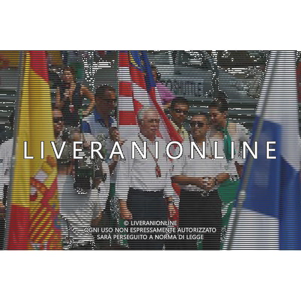 A minute\'s silence is observed on the grid for the victims of flight MH370. 30.03.2014. Formula 1 World Championship, Rd 2, Malaysian Grand Prix, Sepang, Malaysia, Sunday. - www.xpbimages.com, EMail: requests@xpbimages.com - copy of publication required for printed pictures. Every used picture is fee-liable. © Copyright: Batchelor / XPB Images ag aldo liverani sas only italy