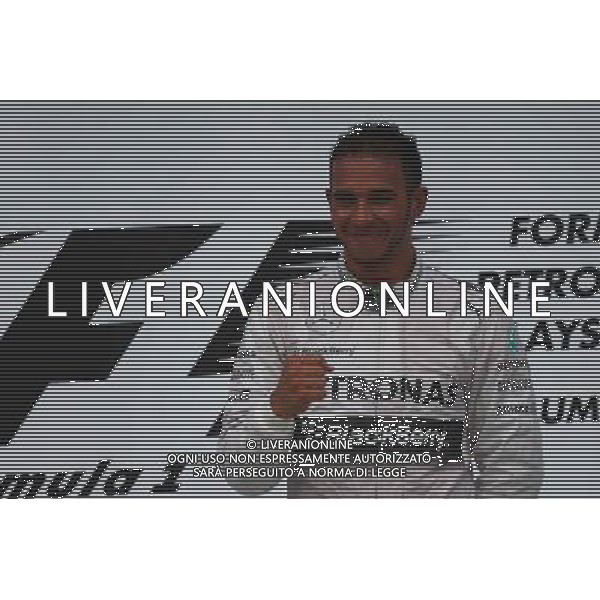 1st place Lewis Hamilton (GBR) Mercedes AMG F1. 30.03.2014. Formula 1 World Championship, Rd 2, Malaysian Grand Prix, Sepang, Malaysia, Sunday. - www.xpbimages.com, EMail: requests@xpbimages.com - copy of publication required for printed pictures. Every used picture is fee-liable. © Copyright: Batchelor / XPB Images AG ALDO LIVERANI SAS ONLY ITALY