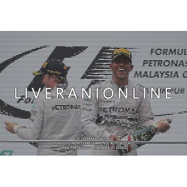 Lewis Hamilton (GBR), Mercedes AMG F1 Team and Nico Rosberg (GER), Mercedes AMG F1 Team 30.03.2014. Formula 1 World Championship, Rd 2, Malaysian Grand Prix, Sepang, Malaysia, Sunday. - www.xpbimages.com, EMail: requests@xpbimages.com - copy of publication required for printed pictures. Every used picture is fee-liable. © Copyright: Charniaux / XPB Images AG ALDO LIVERANI SAS ONLY ITALY