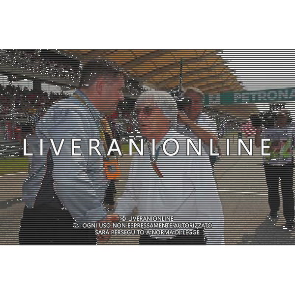(L to R): Paul Hembery (GBR) Pirelli Motorsport Director with Bernie Ecclestone (GBR) on the grid. 30.03.2014. Formula 1 World Championship, Rd 2, Malaysian Grand Prix, Sepang, Malaysia, Sunday. - www.xpbimages.com, EMail: requests@xpbimages.com - copy of publication required for printed pictures. Every used picture is fee-liable. © Copyright: Photo4 / XPB Images AG ALDO LIVERANI SAS ONLY ITALY