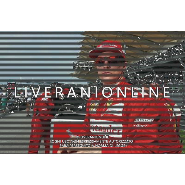 Kimi Raikkonen (FIN) Ferrari on the grid. 30.03.2014. Formula 1 World Championship, Rd 2, Malaysian Grand Prix, Sepang, Malaysia, Sunday. - www.xpbimages.com, EMail: requests@xpbimages.com - copy of publication required for printed pictures. Every used picture is fee-liable. © Copyright: Photo4 / XPB Images AG ALDO LIVERANI SAS ONLY ITALY