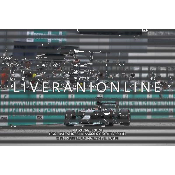 Lewis Hamilton (GBR), Mercedes AMG F1 Team 30.03.2014. Formula 1 World Championship, Rd 2, Malaysian Grand Prix, Sepang, Malaysia, Sunday. - www.xpbimages.com, EMail: requests@xpbimages.com - copy of publication required for printed pictures. Every used picture is fee-liable. © Copyright: Charniaux / XPB Images AG ALDO LIVERANI SAS ONLY ITALY