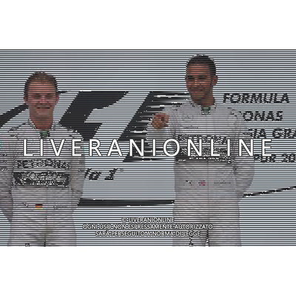 Nico Rosberg (GER), Mercedes AMG F1 Team and Lewis Hamilton (GBR), Mercedes AMG F1 Team 30.03.2014. Formula 1 World Championship, Rd 2, Malaysian Grand Prix, Sepang, Malaysia, Sunday. - www.xpbimages.com, EMail: requests@xpbimages.com - copy of publication required for printed pictures. Every used picture is fee-liable. © Copyright: Charniaux / XPB Images AG ALDO LIVERANI SAS ONLY ITALY