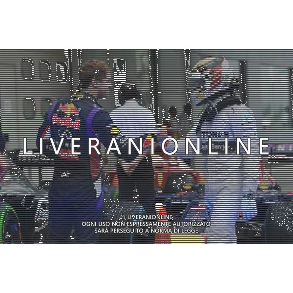 (140329) -- SEPANG, March 29, 2014 () -- Mercedes driver Lewis Hamilton (R) of Britain greets with Red Bull driver Sebastian Vettel of Germany after the qualifying session for the Malaysian Formula One Grand Prix at Sepang International Circuit in Sepang, Malaysia, March 29, 2014. (/Chong Voon Chung) AG ALDOL IVERANI SAS ONLY ITALY