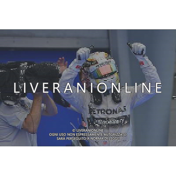 (140329) -- SEPANG, March 29, 2014 () -- Mercedes driver Lewis Hamilton of Britain celebrates after taking the pole position after the qualifying session for the Malaysian Formula One Grand Prix at Sepang International Circuit in Sepang, Malaysia, March 29, 2014. (/Chong Voon Chung) AG ALDOL IVERANI SAS ONLY ITALY