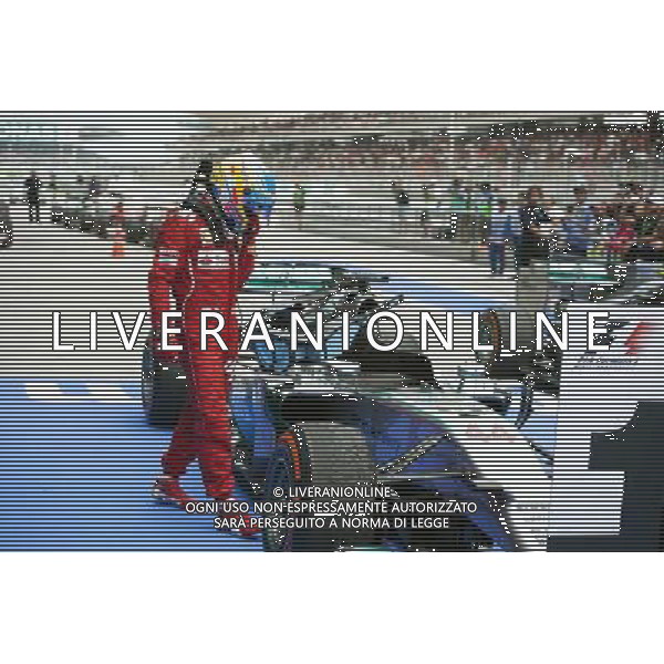 Fernando Alonso (ESP) Ferrari looks at the Mercedes AMG F1 W05 of Lewis Hamilton (GBR) Mercedes AMG F1 in parc ferme. 30.03.2014. Formula 1 World Championship, Rd 2, Malaysian Grand Prix, Sepang, Malaysia, Sunday. - www.xpbimages.com, EMail: requests@xpbimages.com - copy of publication required for printed pictures. Every used picture is fee-liable. Â© Copyright: Price / XPB Images AG ALDO LIVERANI SAS ONLY ITALY