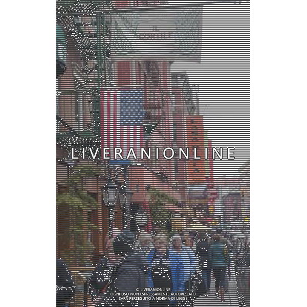Restaurants and businesses along Mulberry Street in the Little Italy neighborhood of New York on Sunday, March 30, 2014. Changing demographics and sharp rent increases have decimated the Little Italy neighborhood reducing the once thriving Italian enclave from a fifty-block area into a short three blocks mostly populated by tourist oriented businesses. Eight restaurants have closed in the past year as their leases came up and negotiations with landlords were fruitless. As Chinatown moves north many Italian businesses had been displaced by businesses catering to their Asian customers. ©photoshot/AGENZIA ALDO LIVERANI SAS - ITALY ONLY - Vedute della citta\' di New York - Vita quotidiana