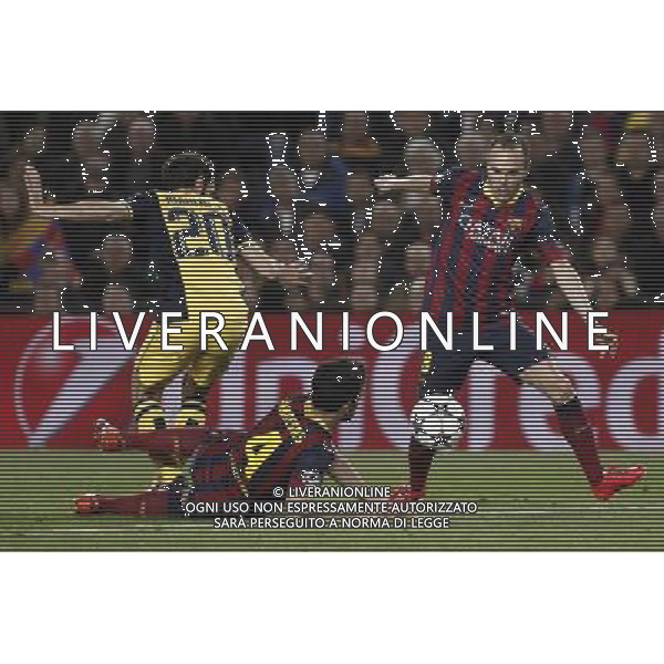 FC Barcelona\'s Spanish midfielder†Andres Iniesta (R) vies for a ball during the Champions League football match 1/4 FC Barcelona - Atletico de Madrid at the Camp Nou Stadium in Barcelona. Spain. Apr. 1, 2014. (Xinhua/Pau Barrena) AG ALDO LIVERANI SAS ONLY ITALY