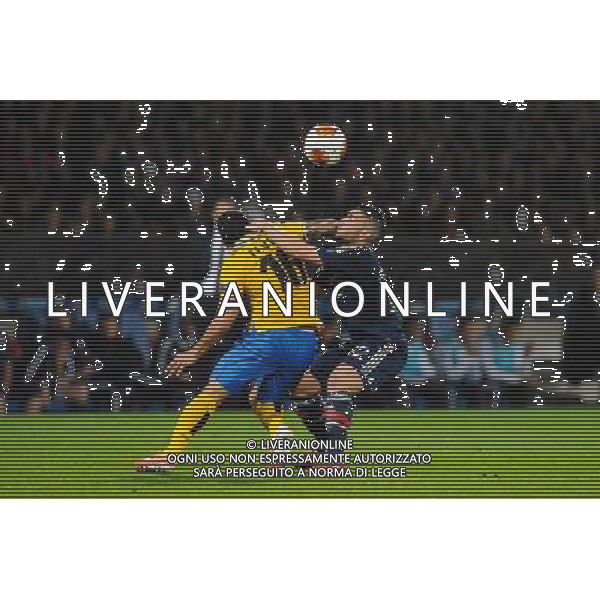 Carlos TEVEZ / Jordan FERRI - 03.02.2014 - Lyon / Juventus Turin - 1/4Finale Aller Ligue Europa Photo : Jean Paul Thomas / Icon Sport /AGENZIA ALDO LIVERANI SAS - ITALY ONLY - EDITORIAL USE ONLY - LIONE Vs JUVENTUS ANDATA QUARTI DI FINALE UEFA EUROPA LEAGUE 03 MARZO 2014