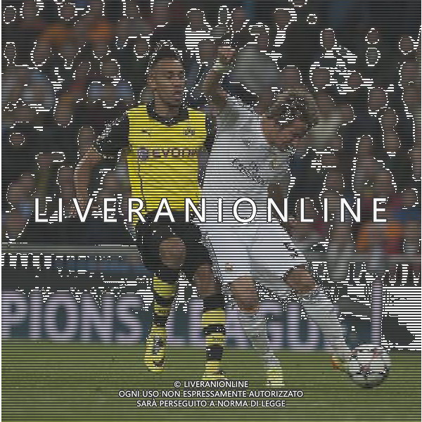 (140403) -- MADRID, April 3, 2014 () -- Real Madrid\'s Fabio Coentrao (R) shoots during the UEFA Champions League quarter-final first leg match against Dortmund at Santiago Bernabeu stadium in Madrid, Spain, April 2, 2014. Real Madrid won the match by 3-0. (/Xie Haining) ©PHOTOSHOT/AGENZIA ALDO LIVERANI SAS - ITALY ONLY - EDITORIAL USE ONLY