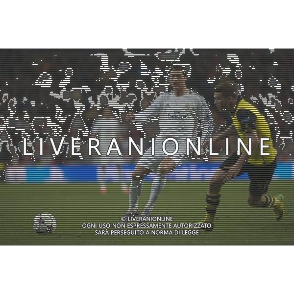 (140403) -- MADRID, April 3, 2014 () -- Real Madrid\'s Cristiano Ronaldo (L) passes the ball during the UEFA Champions League quarter-final first leg match against Dortmund at Santiago Bernabeu stadium in Madrid, Spain, April 2, 2014. Real Madrid won the match by 3-0. (/Xie Haining) ©PHOTOSHOT/AGENZIA ALDO LIVERANI SAS - ITALY ONLY - EDITORIAL USE ONLY