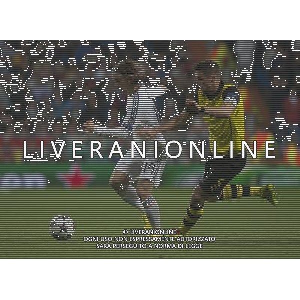 (140403) -- MADRID, April 3, 2014 () -- Real Madrid\'s Luka Modric (L) vies for the ball during the UEFA Champions League quarter-final first leg match against Dortmund at Santiago Bernabeu stadium in Madrid, Spain, April 2, 2014. Real Madrid won the match by 3-0. (/Xie Haining) ©PHOTOSHOT/AGENZIA ALDO LIVERANI SAS - ITALY ONLY - EDITORIAL USE ONLY