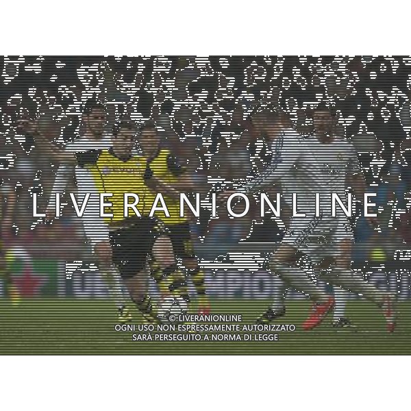 (140403) -- MADRID, April 3, 2014 () -- Dortmund\'s Henrikh Mkhitaryan vies for the ball during the UEFA Champions League quarter-final first leg match against Real Madrid at Santiago Bernabeu stadium in Madrid, Spain, April 2, 2014. Real Madrid won the match by 3-0. (/Xie Haining) ©PHOTOSHOT/AGENZIA ALDO LIVERANI SAS - ITALY ONLY - EDITORIAL USE ONLY