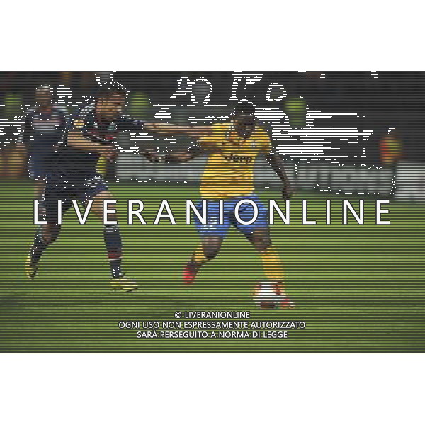 Corentin TOLISSO / Kwadwo Asamoah - 03.02.2014 - Lyon / Juventus Turin - 1/4Finale Aller Ligue Europa Photo : Jean Paul Thomas / Icon Sport *** Local Caption *** AG ALDOLIVERANI SAS ONLYITALY *** Local Caption ***