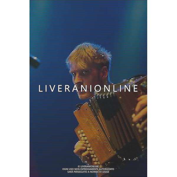 Skinny Lister - Maxwell Thomas - Melodeon, Mandolin, vocals, opening for Boy George and performing live in concert at the Indigo 2, Greenwich, London, United Kingdom Date: 03/04/2014 ©photoshot/AGENZIA ALDO LIVERANI SAS - ITALY ONLY - EDITORIAL USE ONLY