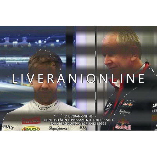 (L to R): Sebastian Vettel (GER) Red Bull Racing with Dr Helmut Marko (AUT) Red Bull Motorsport Consultant. 04.04.2014. Formula 1 World Championship, Rd 3, Bahrain Grand Prix, Sakhir, Bahrain, Practice Day - www.xpbimages.com, EMail: requests@xpbimages.com - copy of publication required for printed pictures. Every used picture is fee-liable. © Copyright: Batchelor / XPB Images AG ALDO LIVERANI SAS ONLY ITALY
