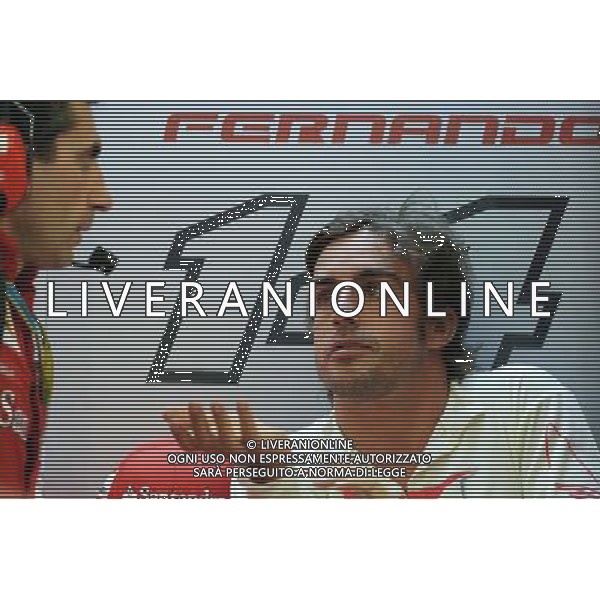(L to R): Andrea Stella (ITA) Ferrari Race Engineer with Fernando Alonso (ESP) Ferrari. 04.04.2014. Formula 1 World Championship, Rd 3, Bahrain Grand Prix, Sakhir, Bahrain, Practice Day - www.xpbimages.com, EMail: requests@xpbimages.com - copy of publication required for printed pictures. Every used picture is fee-liable. © Copyright: Photo4 / XPB Images AG ALDO LIVERANI SAS ONLY ITALY