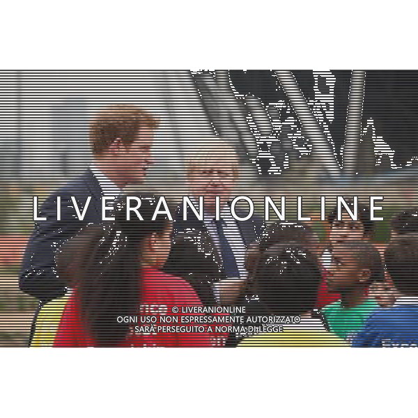 HRH Prince Harry and Mayor of London Boris Johnson meet a group of children during an official visit to Queen Elizabeth Olympic Park on April 4, 2014 in London, England. ©photoshot/AGENZIA ALDO LIVERANI SAS - ITALY ONLY - EDITORIAL USE ONLY - REALI INGLESI: Il principe Harry d\'inghilterra con i bambini delle scuole locali da Gainsborough a Newham presso il nuovo Parco Olimpico Queen Elizabeth, con il sindaco di Londra, Boris Johnson