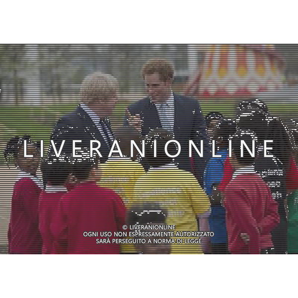 Prince Harry with the Mayor of London, Boris Johnson and local school children from Gainsborough Primary school in Newham at the new Queen Elizabeth Olympic Park. The park will open to the public on Saturday 5th April. 14 ©photoshot/AGENZIA ALDO LIVERANI SAS - ITALY ONLY - EDITORIAL USE ONLY - REALI INGLESI: Il principe Harry d\'inghilterra con i bambini delle scuole locali da Gainsborough a Newham presso il nuovo Parco Olimpico Queen Elizabeth, con il sindaco di Londra, Boris Johnson