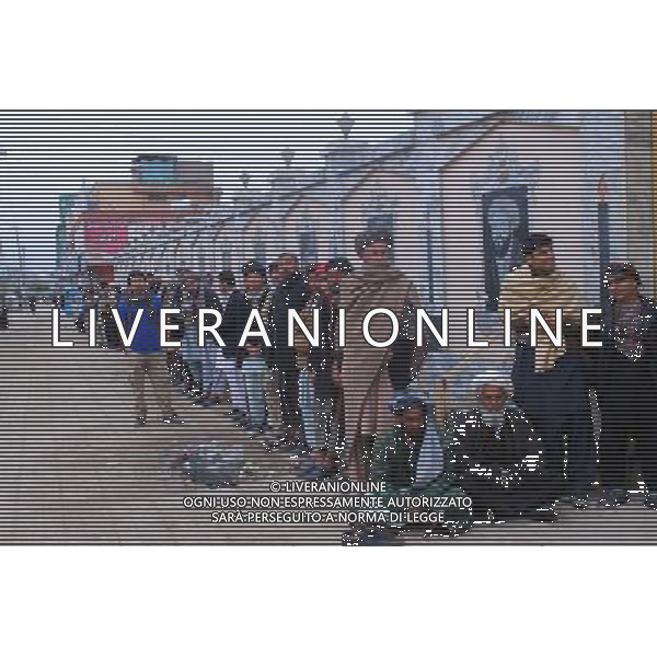 (140405) -- MAZAR-I-SHARIF, April 5, 2014 () -- Voters wait in queue outside a polling station in Mazar-i-Sharif, Afghanistan, April 5, 2014. Afghani presidential election takes place on April 5. (/Azorda) ©photoshot/AGENZIA ALDO LIVERANI SAS - ITALY ONLY - Voto per le elezioni presidenziali in Afghanistan 5 APRILE 2014