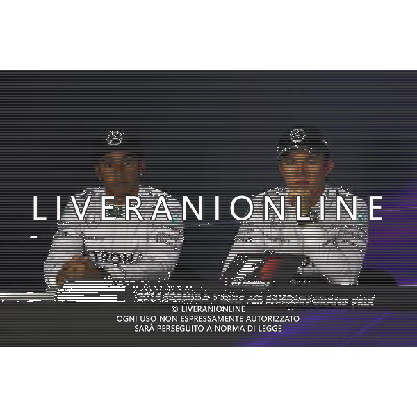 (L to R): Lewis Hamilton (GBR) Mercedes AMG F1 and team mate Nico Rosberg (GER) Mercedes AMG F1 in the FIA Press Conference. 05.04.2014. Formula 1 World Championship, Rd 3, Bahrain Grand Prix, Sakhir, Bahrain, Qualifying Day. - www.xpbimages.com, EMail: requests@xpbimages.com - copy of publication required for printed pictures. Every used picture is fee-liable. © Copyright: Moy / XPB Images AG ALDO LIVERANI SAS ONLY ITALY
