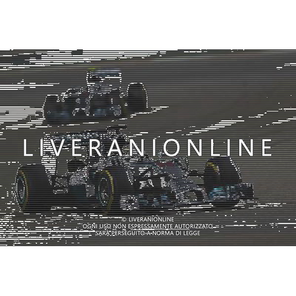 Lewis Hamilton (GBR) Mercedes AMG F1 W05 leads team mate Nico Rosberg (GER) Mercedes AMG F1 W05. 06.04.2014. Formula 1 World Championship, Rd 3, Bahrain Grand Prix, Sakhir, Bahrain, Race Day. - www.xpbimages.com, EMail: requests@xpbimages.com - copy of publication required for printed pictures. Every used picture is fee-liable. © Copyright: Batchelor / XPB Images AG ALDO LIVERANI SAS ONLY ITALY