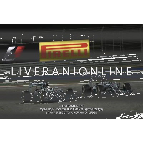 (L to R): Lewis Hamilton (GBR) Mercedes AMG F1 W05 and team mate Nico Rosberg (GER) Mercedes AMG F1 W05 battle for position. 06.04.2014. Formula 1 World Championship, Rd 3, Bahrain Grand Prix, Sakhir, Bahrain, Race Day. - www.xpbimages.com, EMail: requests@xpbimages.com - copy of publication required for printed pictures. Every used picture is fee-liable. © Copyright: Batchelor / XPB Images AG ALDO LIVERANI SAS ONLY ITALY