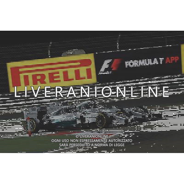 Nico Rosberg (GER) Mercedes AMG F1 W05 and Lewis Hamilton (GBR) Mercedes AMG F1 W05 battle for position. 06.04.2014. Formula 1 World Championship, Rd 3, Bahrain Grand Prix, Sakhir, Bahrain, Race Day. - www.xpbimages.com, EMail: requests@xpbimages.com - copy of publication required for printed pictures. Every used picture is fee-liable. © Copyright: Batchelor / XPB Images AG ALDO LIVERANI SAS ONLY ITALY 