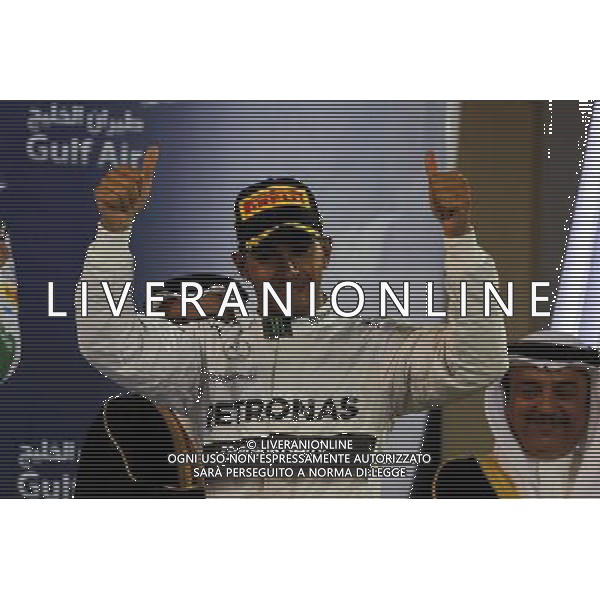 Race winner Lewis Hamilton (GBR) Mercedes AMG F1 celebrates on the podium. 06.04.2014. Formula 1 World Championship, Rd 3, Bahrain Grand Prix, Sakhir, Bahrain, Race Day. - www.xpbimages.com, EMail: requests@xpbimages.com - copy of publication required for printed pictures. Every used picture is fee-liable. © Copyright: Moy / XPB Images AG ALDO LIVERANI SAS ONLY ITALY