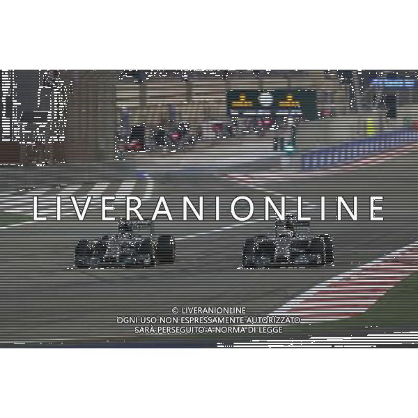 Lewis Hamilton (GBR), Mercedes AMG F1 Team and Nico Rosberg (GER), Mercedes AMG F1 Team 06.04.2014. Formula 1 World Championship, Rd 3, Bahrain Grand Prix, Sakhir, Bahrain, Race Day. - www.xpbimages.com, EMail: requests@xpbimages.com - copy of publication required for printed pictures. Every used picture is fee-liable. © Copyright: Charniaux / XPB Images AG ALDO LIVERANI SAS ONLY ITALY