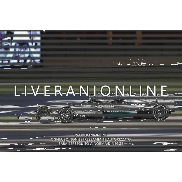 Lewis Hamilton (GBR), Mercedes AMG F1 Team and Nico Rosberg (GER), Mercedes AMG F1 Team 06.04.2014. Formula 1 World Championship, Rd 3, Bahrain Grand Prix, Sakhir, Bahrain, Race Day. - www.xpbimages.com, EMail: requests@xpbimages.com - copy of publication required for printed pictures. Every used picture is fee-liable. © Copyright: Charniaux / XPB Images AG ALDO LIVERANI SAS ONLY ITALY