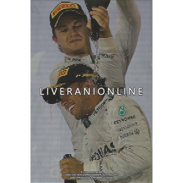 Lewis Hamilton (GBR), Mercedes AMG F1 Team and Nico Rosberg (GER), Mercedes AMG F1 Team 06.04.2014. Formula 1 World Championship, Rd 3, Bahrain Grand Prix, Sakhir, Bahrain, Race Day. - www.xpbimages.com, EMail: requests@xpbimages.com - copy of publication required for printed pictures. Every used picture is fee-liable. © Copyright: Charniaux / XPB Images AG ALDO LIVERANI SAS ONLY ITALY