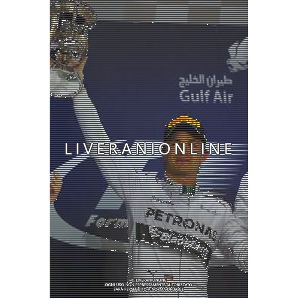 Nico Rosberg (GER) Mercedes AMG F1 celebrates his second position on the podium. 06.04.2014. Formula 1 World Championship, Rd 3, Bahrain Grand Prix, Sakhir, Bahrain, Race Day. - www.xpbimages.com, EMail: requests@xpbimages.com - copy of publication required for printed pictures. Every used picture is fee-liable. © Copyright: Moy / XPB Images AG ALDO LIVERANI SAS ONLY ITALY