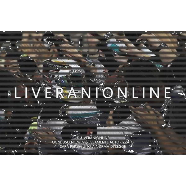 Race winner Lewis Hamilton (GBR) Mercedes AMG F1 celebrates with the team in parc ferme. 06.04.2014. Formula 1 World Championship, Rd 3, Bahrain Grand Prix, Sakhir, Bahrain, Race Day. - www.xpbimages.com, EMail: requests@xpbimages.com - copy of publication required for printed pictures. Every used picture is fee-liable. © Copyright: Photo4 / XPB Images AG ALDO LIVERANI SAS ONLY ITALY