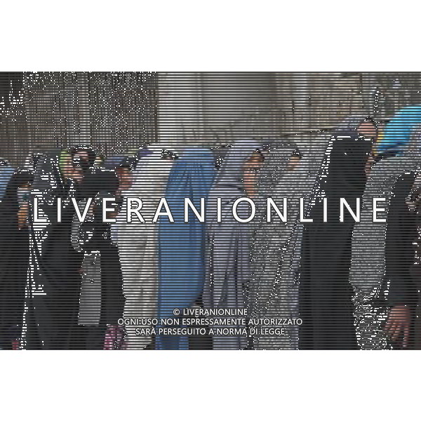 (140406) -- KABUL, April 6, 2014 () -- Afghan women line up to cast their ballots at a polling center in Kabul, Afghanistan, on April 5, 2014. The polling for Afghanistan\'s presidential election concluded on Saturday and counting of ballots has begun, the country\'s election officials said. A total of 6,218 polling centers remained open on the election day and around 7 million eligible voters, 36 percent of them women, had cast their votes. (/Omid) ©PHOTOSHOT/AGENZIA ALDO LIVERANI SAS - ITALY ONLY - Voto per le elezioni presidenziali in Afghanistan 6 APRILE 2014