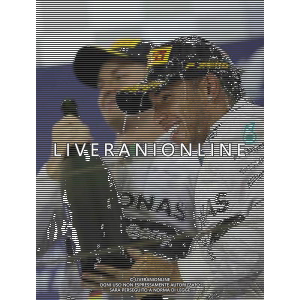 (140407) -- MANAMA, April 7, 2014() -- Mercedes\' Lewis Hamilton (R) and Nico Rosberg celebrate after the final of Formula 1 Bahrain Grand Prix in Manama, Bahrain, on April 6, 2014. Hamilton won the title with 1 hour 39 minutes and 42.743 seconds. (/Hasan Jamali) ©photoshot/AGENZIA ALDO LIVERANI SAS - ITALY ONLY - EDITORIAL USE ONLY
