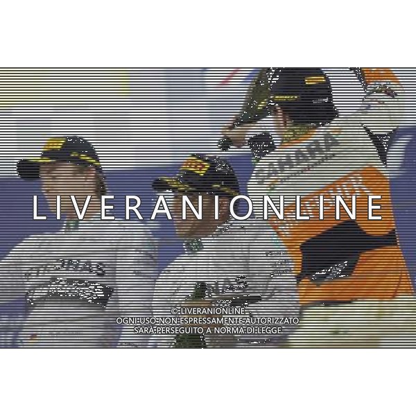 (140407) -- MANAMA, April 7, 2014() -- Mercedes\' Lewis Hamilton (C), Nico Rosberg (L) and Force India\'s Sergio Perez celebrate after the final of Formula 1 Bahrain Grand Prix in Manama, Bahrain, on April 6, 2014. Hamilton won the title with 1 hour 39 minutes and 42.743 seconds. (/Hasan Jamali) ©photoshot/AGENZIA ALDO LIVERANI SAS - ITALY ONLY - EDITORIAL USE ONLY