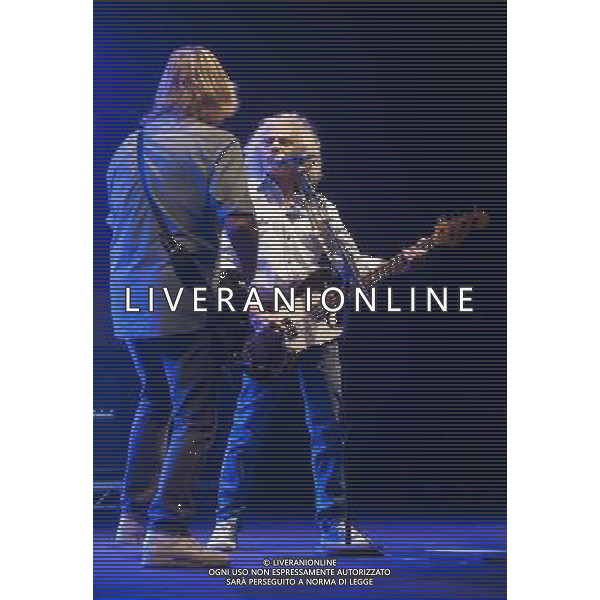 Status Quo performing at Manchester O2 Apollo, England on 6th April 2014. Rick Parfitt â€“ guitar, vocals and Alan Lancaster â€“ bass, vocals. ©PHOTOSHOT/AGENZIA ALDO LIVERANI SAS - ITALY ONLY - EDITORIAL USE ONLY