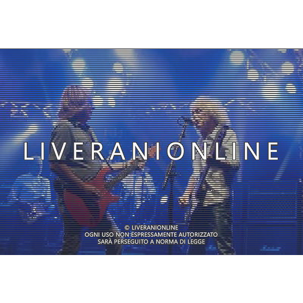 Status Quo performing at Manchester O2 Apollo, England on 6th April 2014. Rick Parfitt â€“ guitar, vocals and Alan Lancaster â€“ bass, vocals. (background : Francis Rossi â€“ guitar, vocals, John Coghlan â€“ drums). ©PHOTOSHOT/AGENZIA ALDO LIVERANI SAS - ITALY ONLY - EDITORIAL USE ONLY