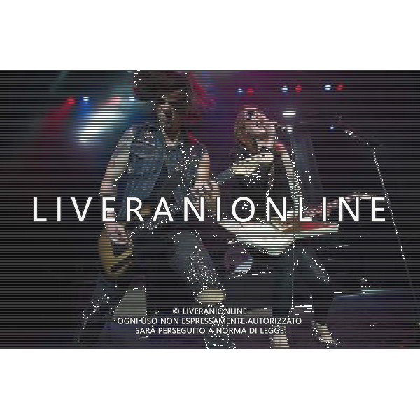 Lead guitarist Joe Hottinger and lead singer Lzzy Hale of American hard rock band Halestorm performing at The Forum, London, England, UK on Wednesday 9th April 2014. AG ALDO LIVERANI SAS ONLY ITALY