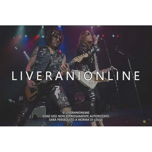 Lead guitarist Joe Hottinger and lead singer Lzzy Hale of American hard rock band Halestorm performing at The Forum, London, England, UK on Wednesday 9th April 2014. AG ALDO LIVERANI SAS ONLY ITALY